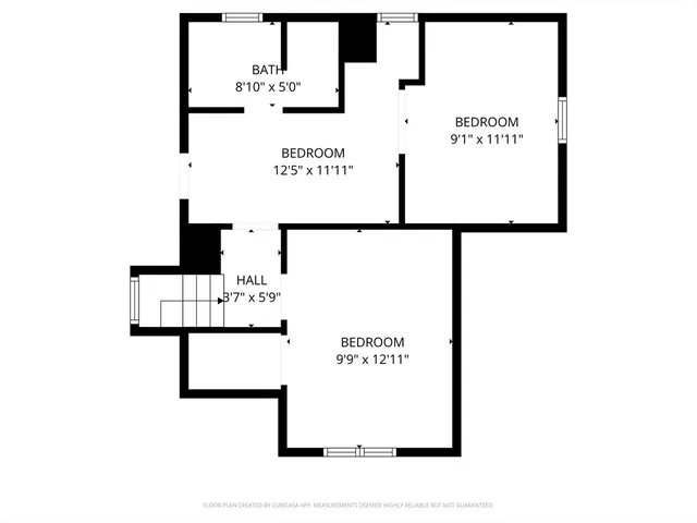 a picture of a building with a white fence