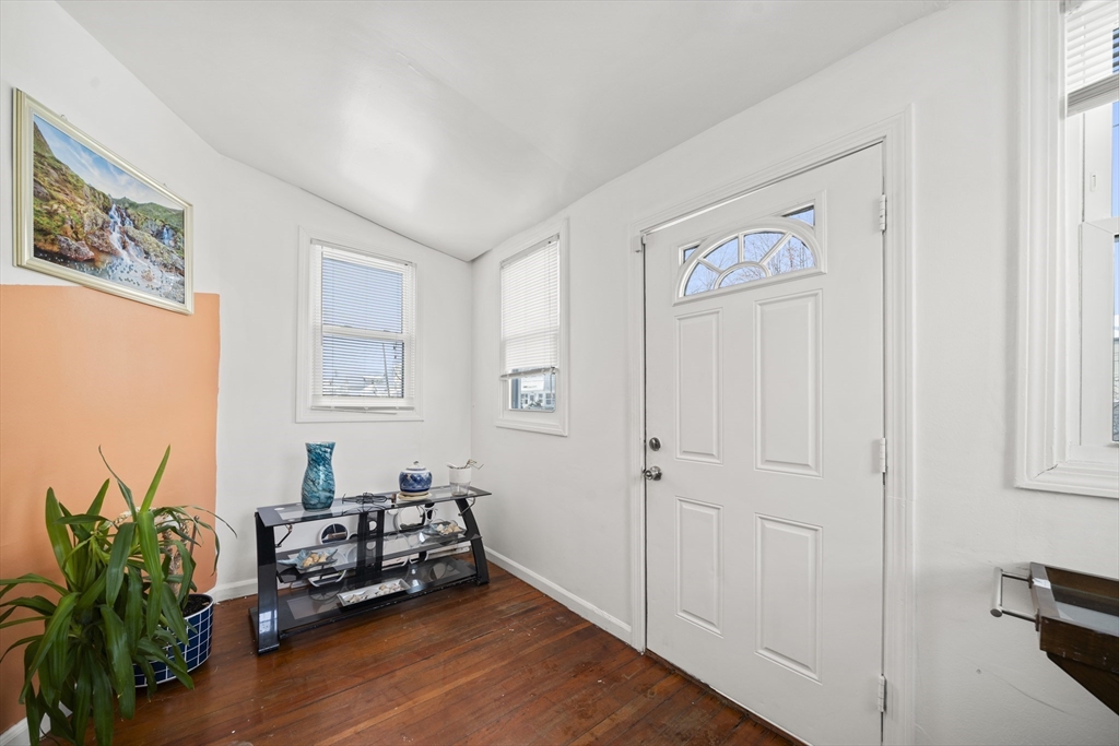55 Malden Street Springfield, MA 01108 - Photo 4 of 40 a living room with furniture and a potted plant