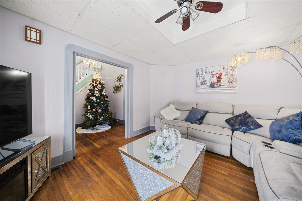 55 Malden Street Springfield, MA 01108 - Photo 7 of 40 a living room with furniture and a flat screen tv