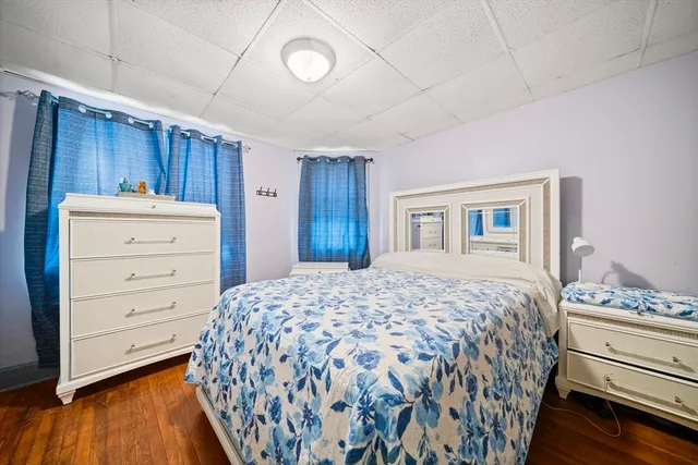 a bedroom with a bed and a dresser