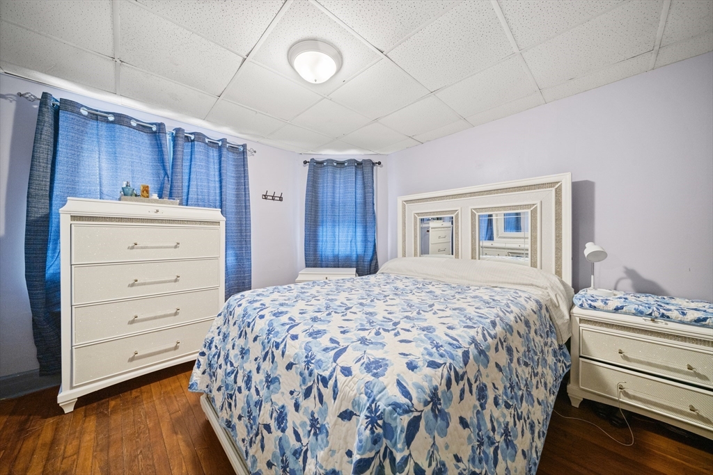 55 Malden Street Springfield, MA 01108 - Photo 9 of 40 a bedroom with a bed and a dresser
