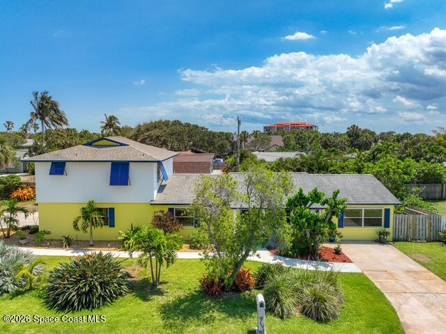 205 Rita Boulevard Melbourne Beach, FL 32951 - Photo 1 of 19 a front view of a house with a yard
