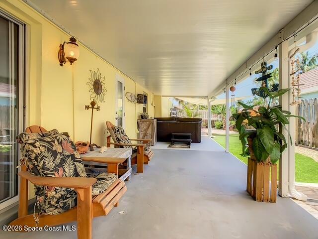 205 Rita Boulevard Melbourne Beach, FL 32951 - Photo 16 of 19 a living room with furniture a fireplace and a potted plant