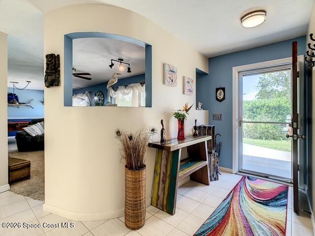 205 Rita Boulevard Melbourne Beach, FL 32951 - Photo 3 of 19 a view of a workspace with furniture and a window