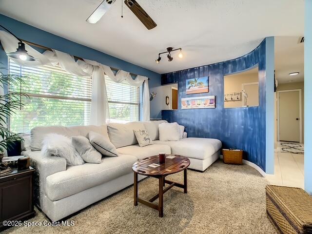 205 Rita Boulevard Melbourne Beach, FL 32951 - Photo 4 of 19 a living room with furniture and a large window