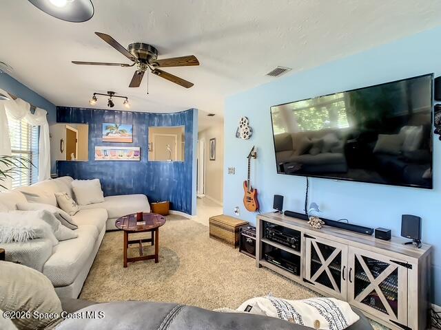 205 Rita Boulevard Melbourne Beach, FL 32951 - Photo 5 of 19 a living room with furniture and a flat screen tv