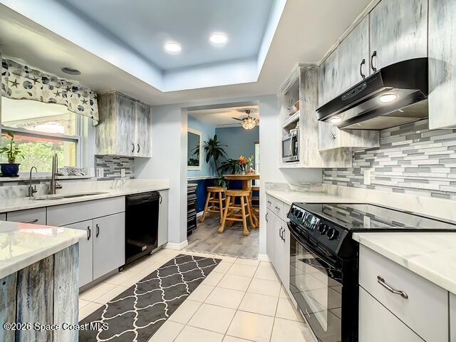 205 Rita Boulevard Melbourne Beach, FL 32951 - Photo 8 of 19 a kitchen with stainless steel appliances granite countertop a sink stove and cabinets