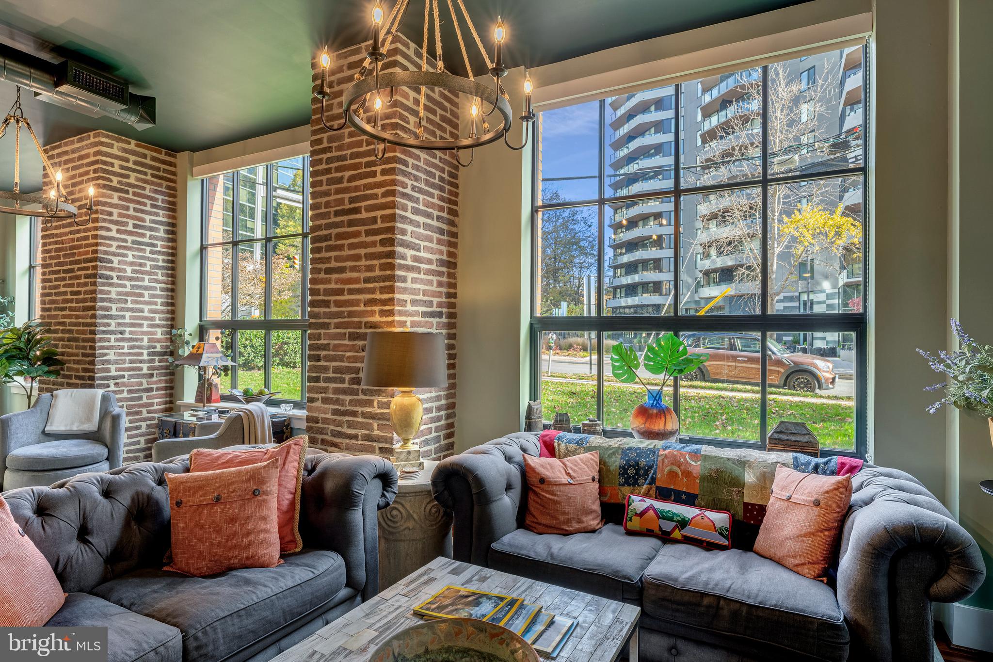 1600 Clarendon Boulevard, Unit W108 Arlington, VA 22209 - Photo 15 of 50 a living room with furniture and a large window