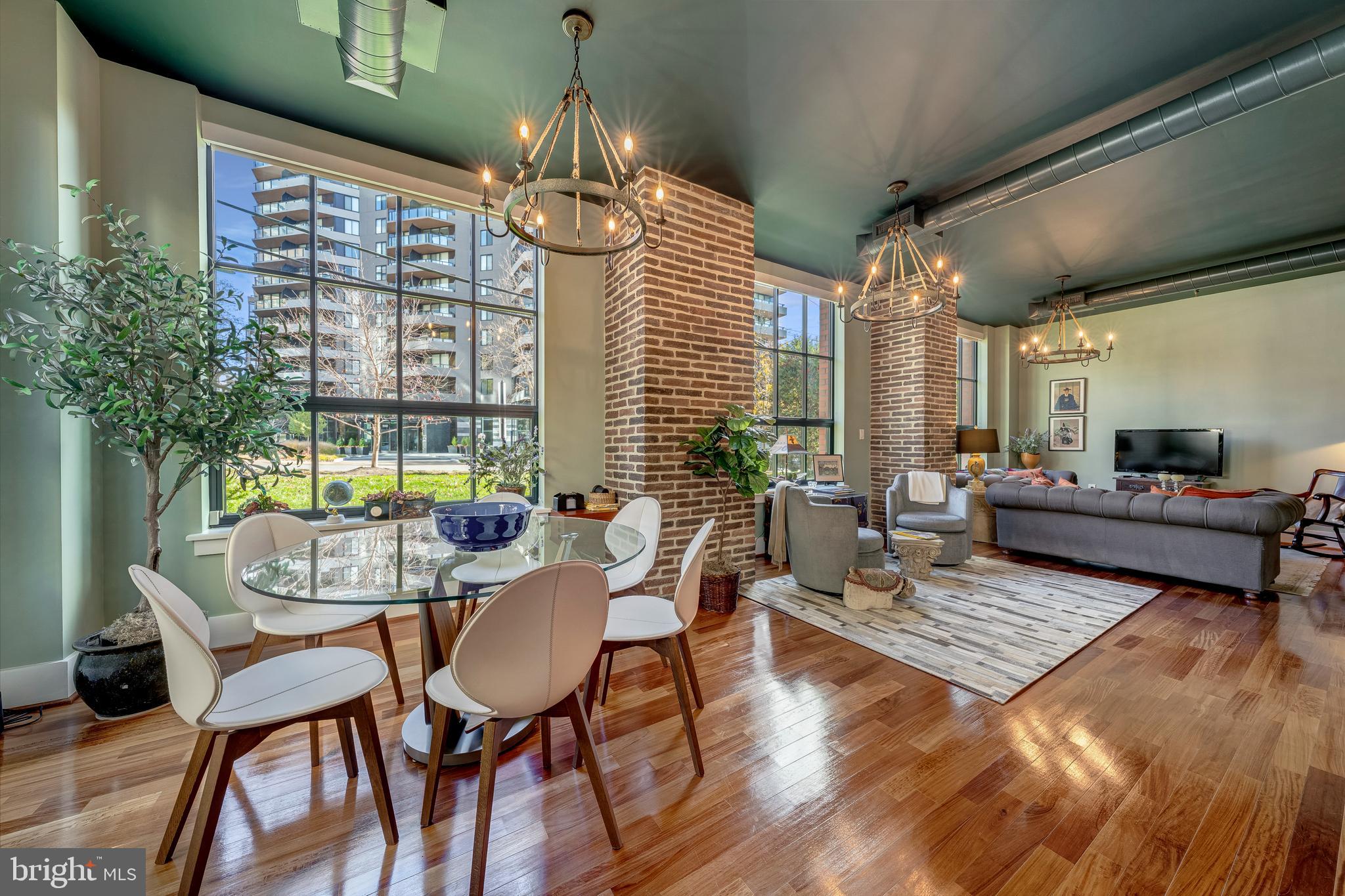 1600 Clarendon Boulevard, Unit W108 Arlington, VA 22209 - Photo 50 of 50 a view of a dining room with furniture wooden floor and chandelier