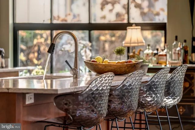 a stove top oven sitting inside of a kitchen