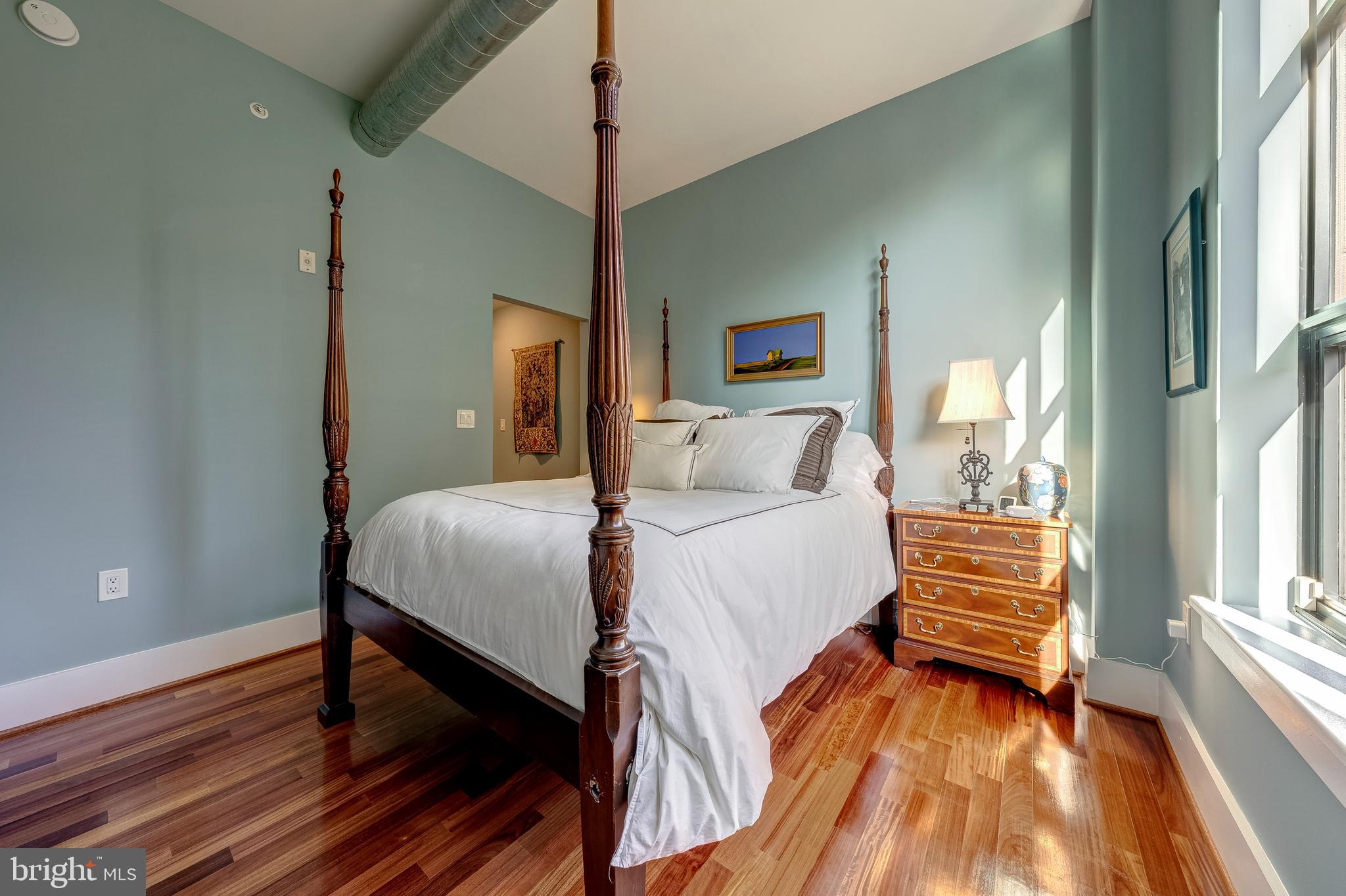 1600 Clarendon Boulevard, Unit W108 Arlington, VA 22209 - Photo 24 of 50 a bedroom with a bed and a window