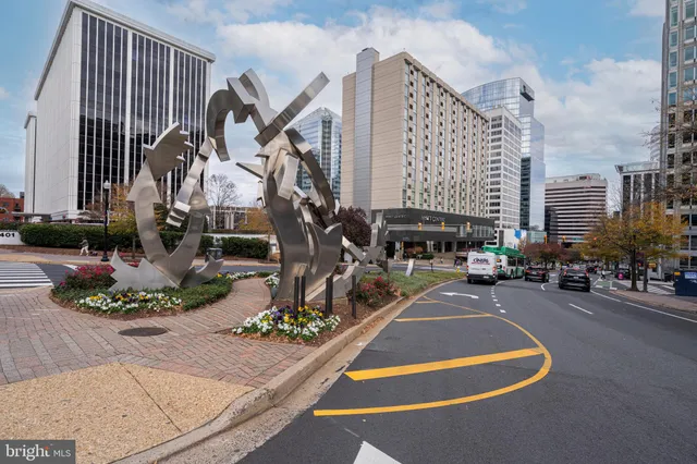 a street view with tall buildings and a street