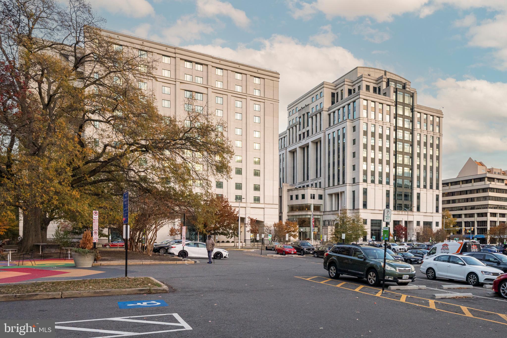1600 Clarendon Boulevard, Unit W108 Arlington, VA 22209 - Photo 41 of 50 a city street lined with parked cars and buildings
