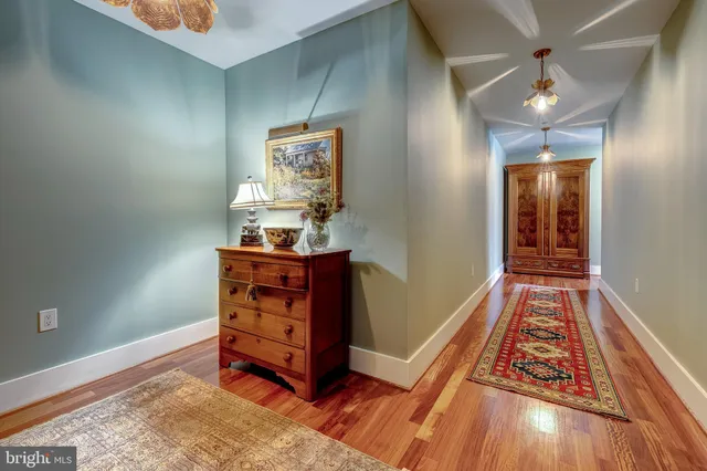 a living room with furniture rug and window