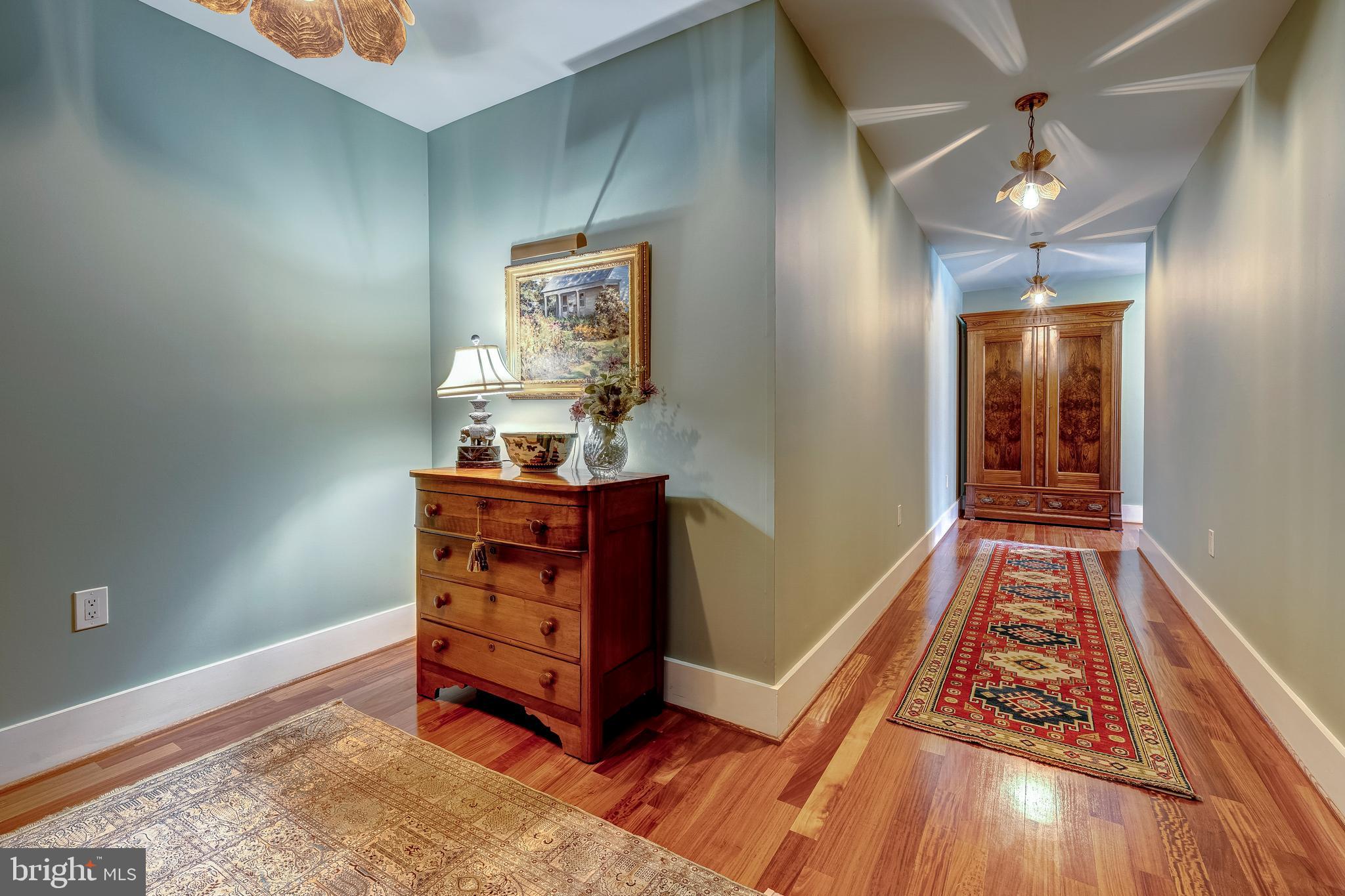 1600 Clarendon Boulevard, Unit W108 Arlington, VA 22209 - Photo 8 of 50 a view of a hallway with wooden floor and staircase