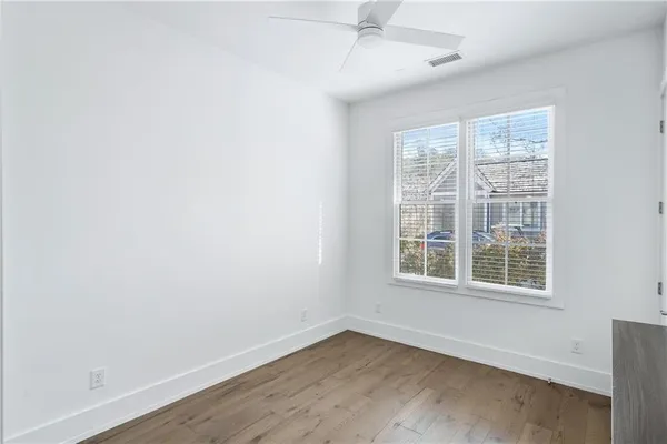 an empty room with wooden floor