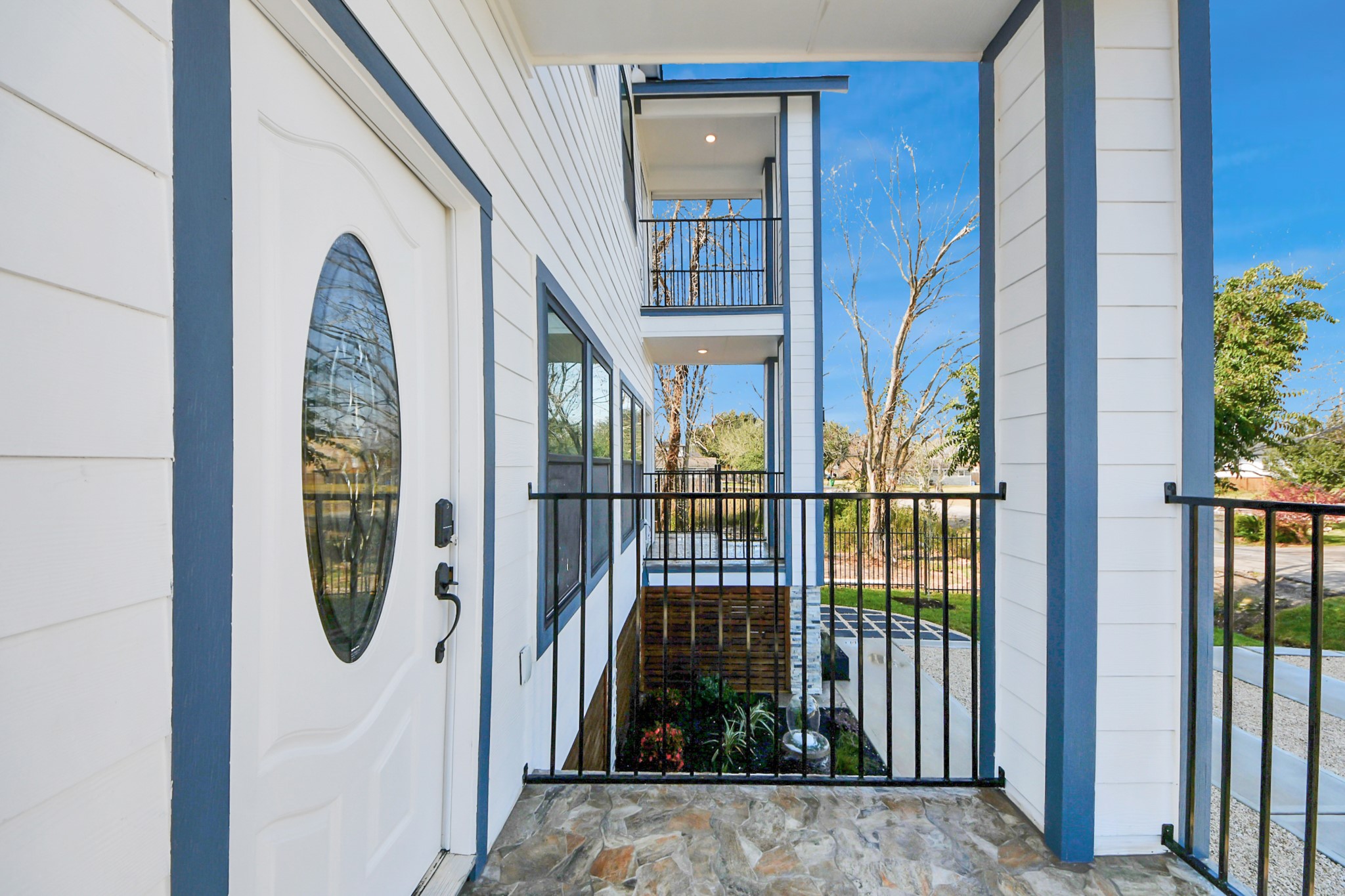 5226 Ricky Street Houston, TX 77033 - Photo 49 of 50 a view of a staircase with wooden floor and a wall painting