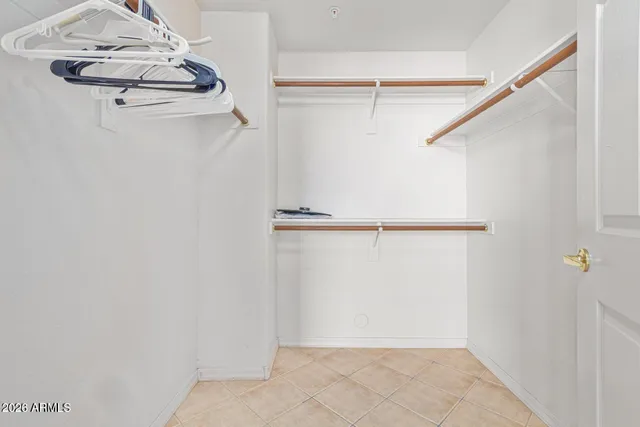 a bathroom with a sink mirror and shower
