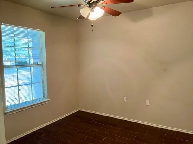 a view of a chandelier fan in a room
