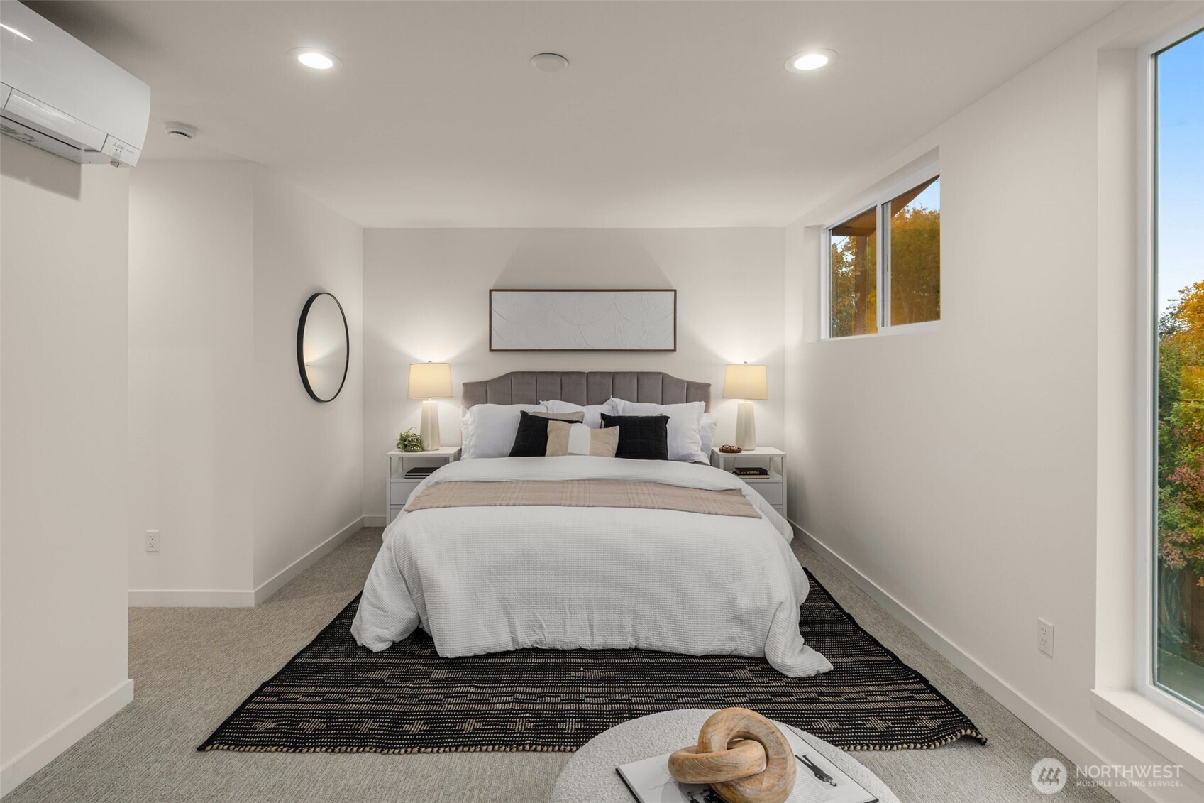 4409 B 21st Avenue Southwest Seattle, WA 98106 - Photo 11 of 23 a bedroom with a bed and wooden floor