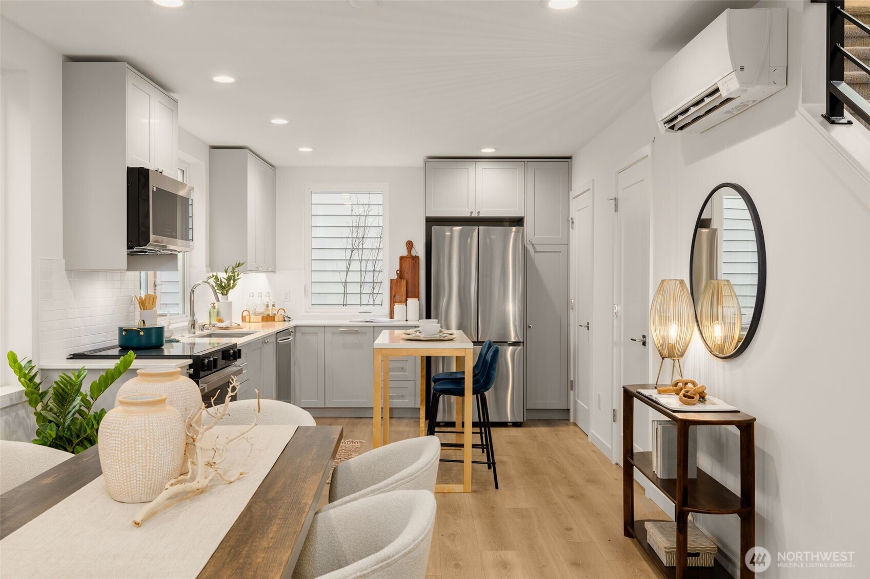 4409 B 21st Avenue Southwest Seattle, WA 98106 - Photo 5 of 23 a living room with furniture a mirror and a table