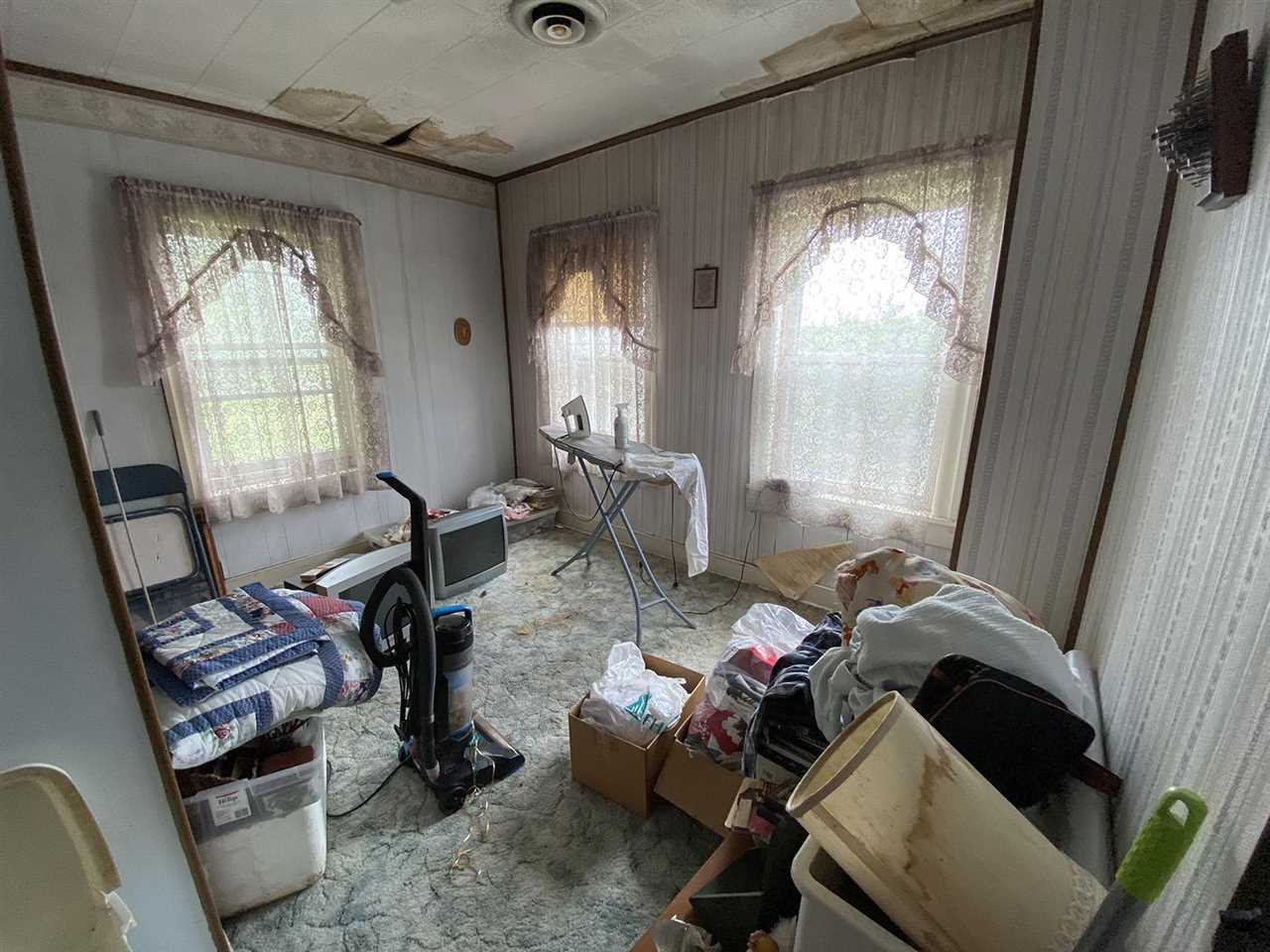 10600 Flory Road Lanark, IL 61046 - Photo 20 of 23 a living room with furniture and a window