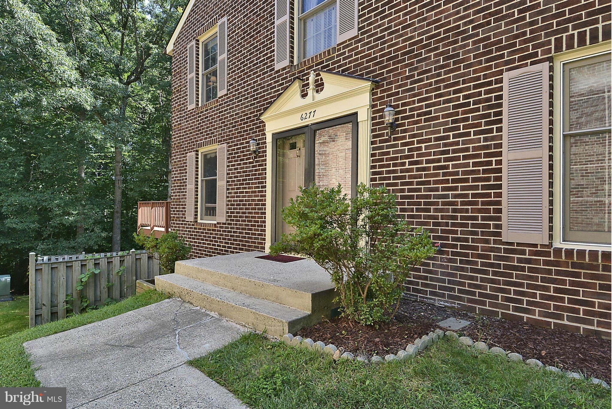 6277 Rathlin Drive Springfield, VA 22152 - Photo 2 of 30 a front view of a house with a garden