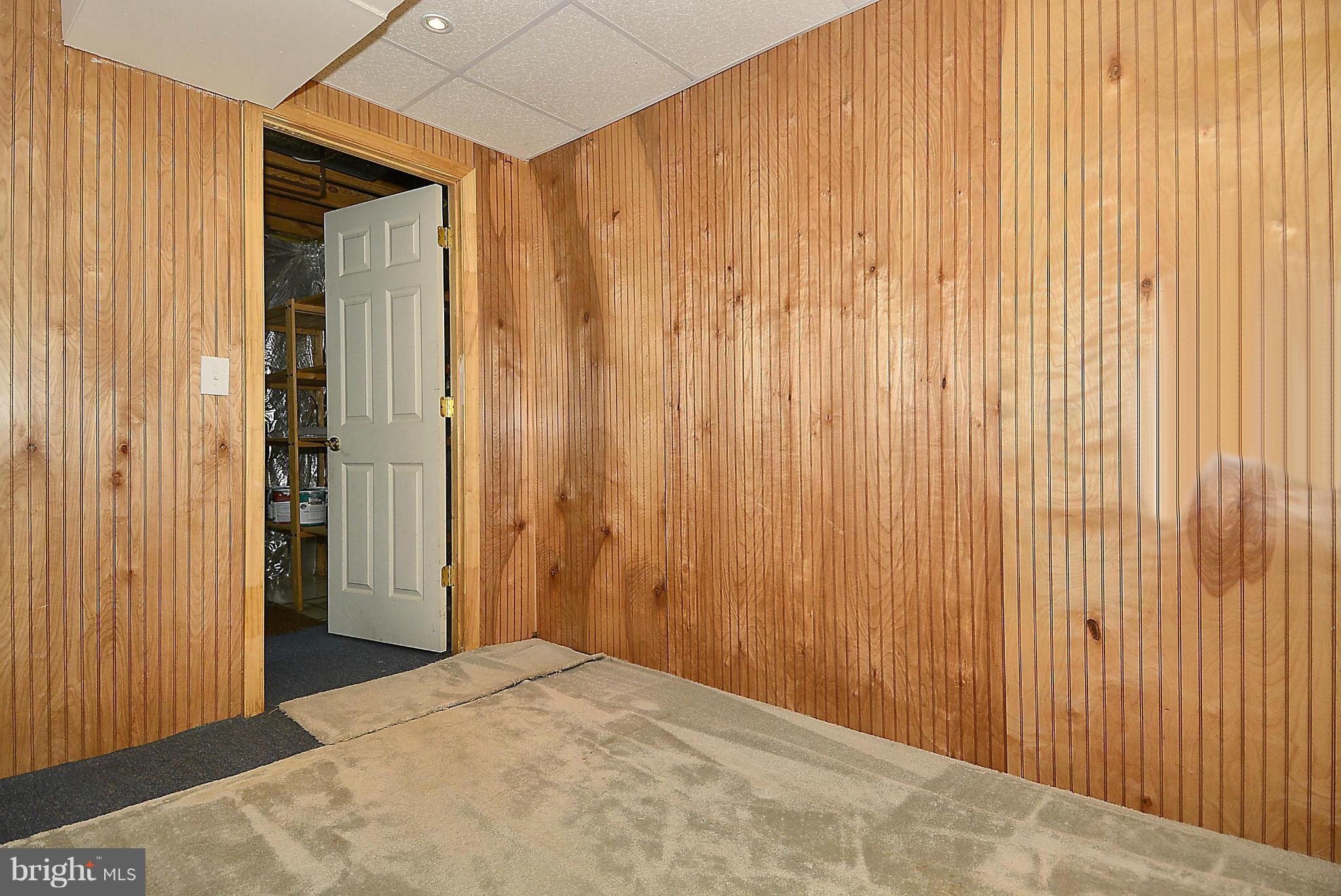 6277 Rathlin Drive Springfield, VA 22152 - Photo 18 of 30 a view of a room with a wooden wall