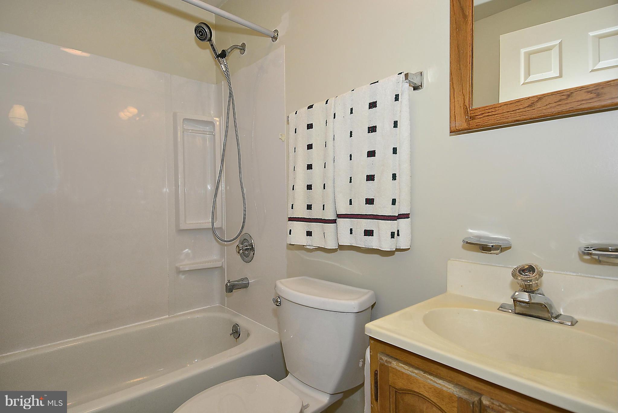 6277 Rathlin Drive Springfield, VA 22152 - Photo 19 of 30 a bathroom with a sink toilet and shower