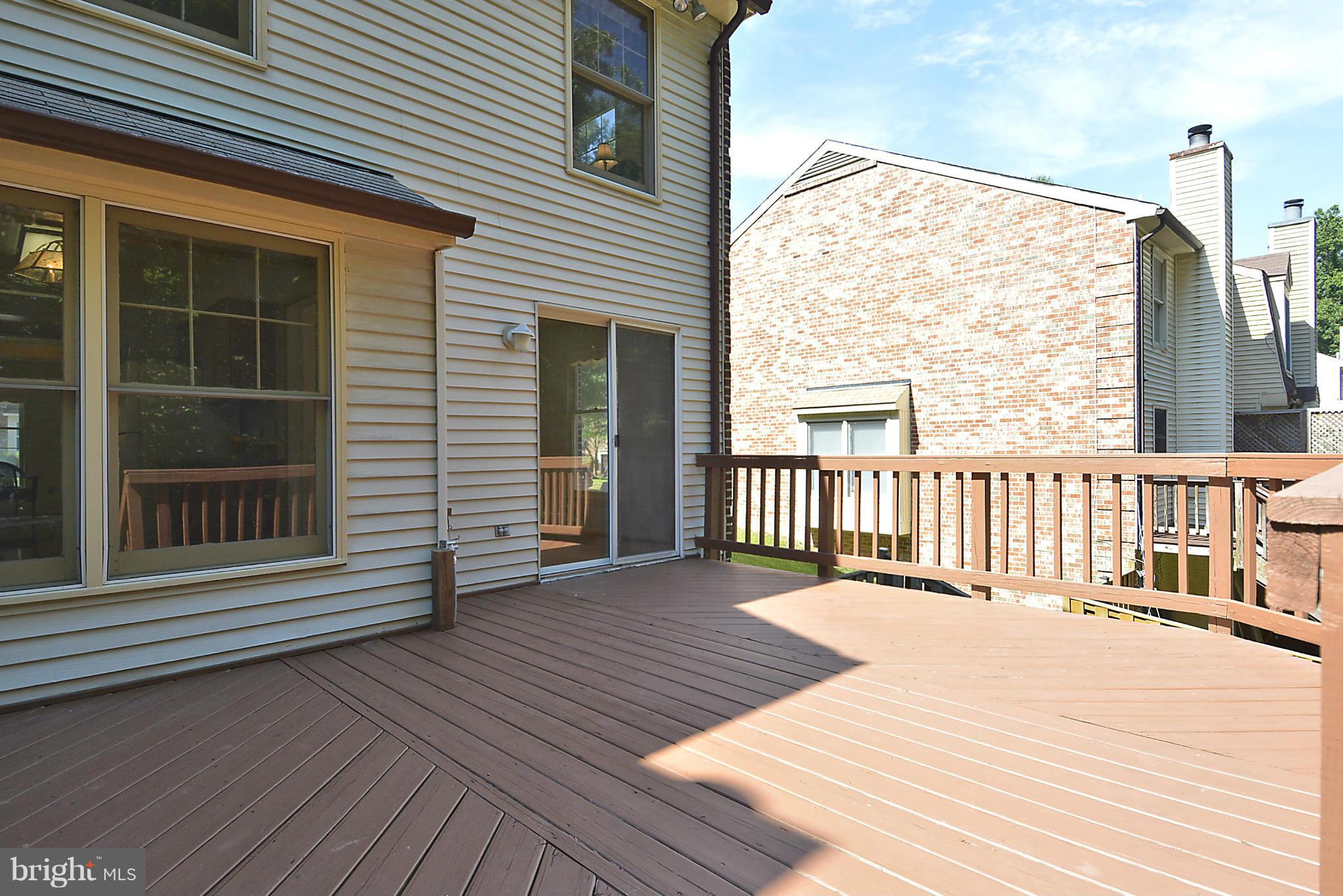 6277 Rathlin Drive Springfield, VA 22152 - Photo 21 of 30 a balcony with view of wooden floor and fence