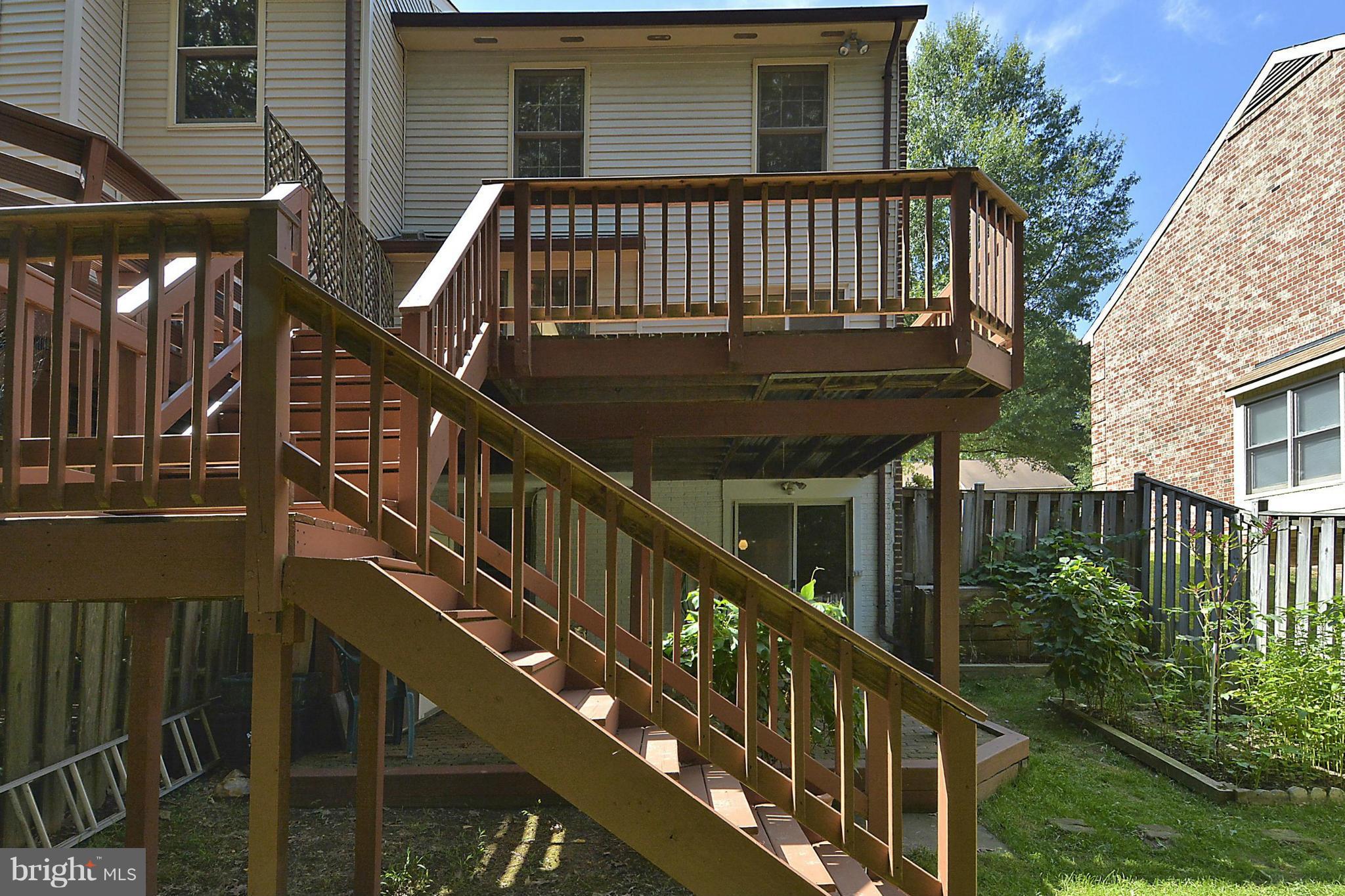 6277 Rathlin Drive Springfield, VA 22152 - Photo 25 of 30 a view of balcony with furniture and wooden deck