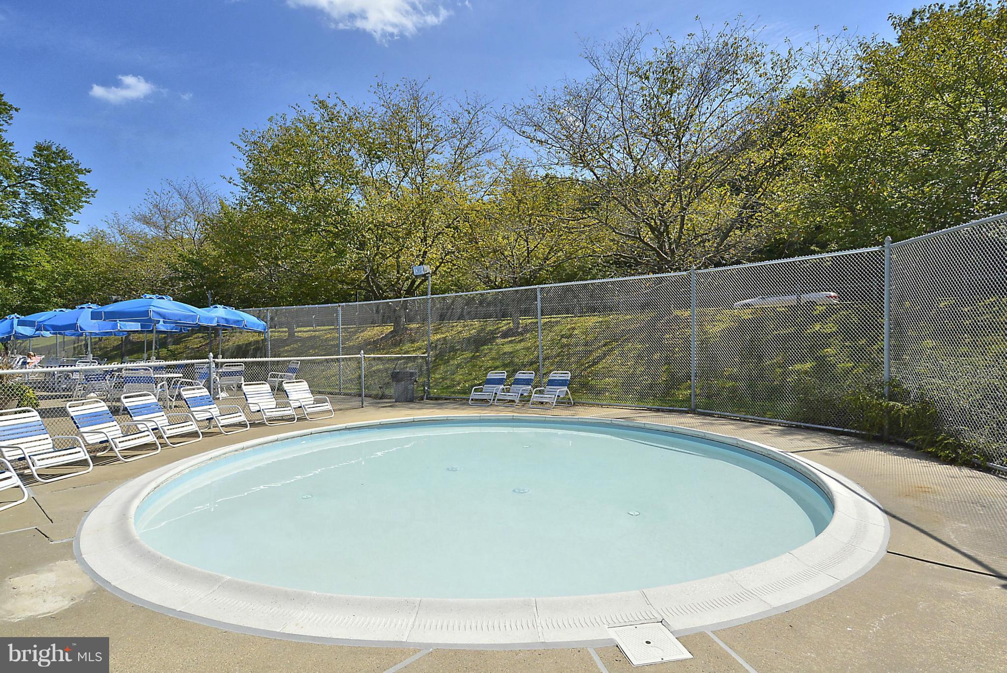 6277 Rathlin Drive Springfield, VA 22152 - Photo 28 of 30 a view of a swimming pool with a patio