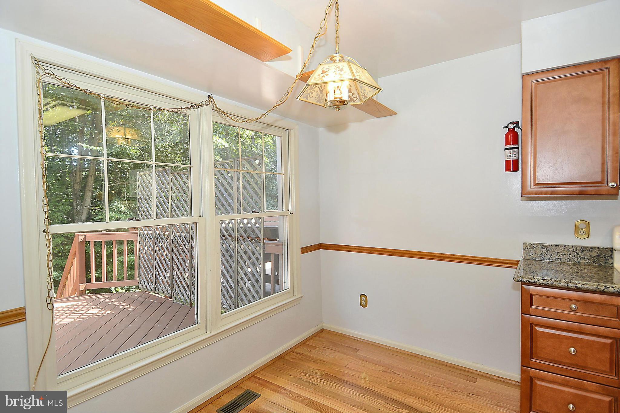 6277 Rathlin Drive Springfield, VA 22152 - Photo 7 of 30 a view of front door with wooden floor
