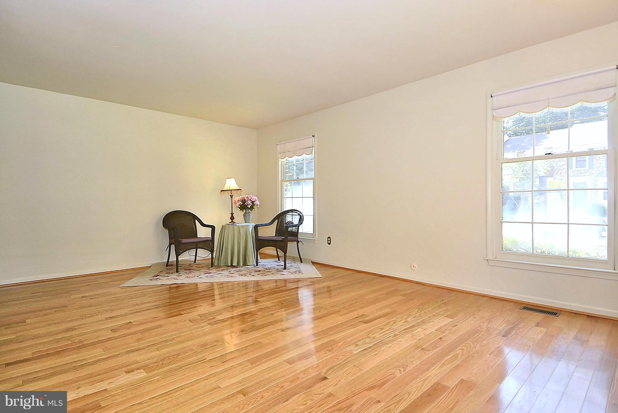 6277 Rathlin Drive Springfield, VA 22152 - Photo 8 of 30 a dining room with furniture and wooden floor