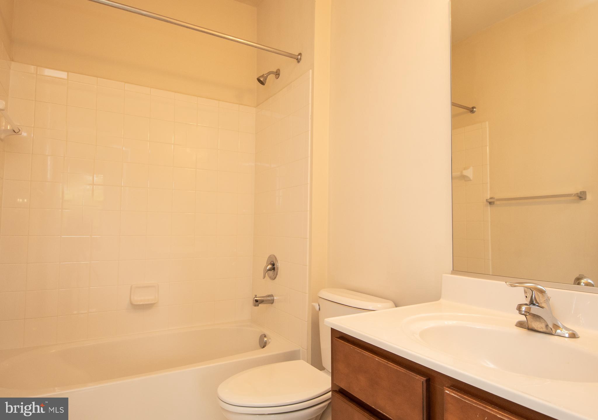 22199 Falling Terrace Ashburn, VA 20148 - Photo 11 of 58 a bathroom with a sink a toilet and shower