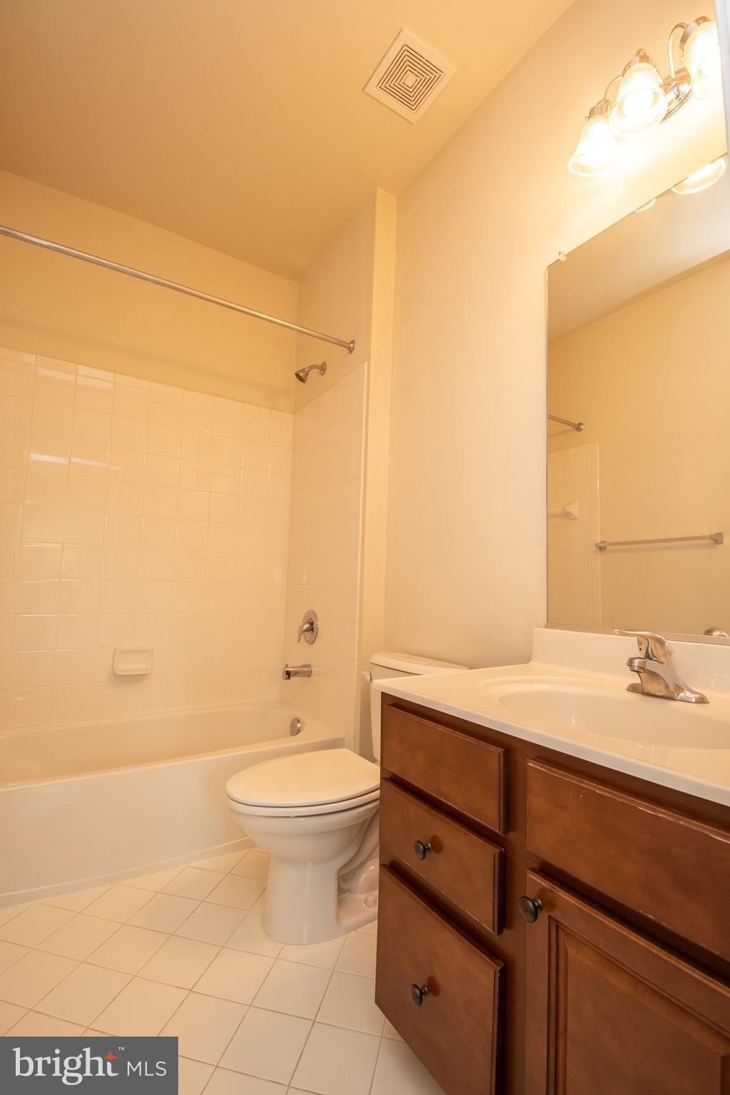 22199 Falling Terrace Ashburn, VA 20148 - Photo 12 of 58 a bathroom with a sink a toilet and shower