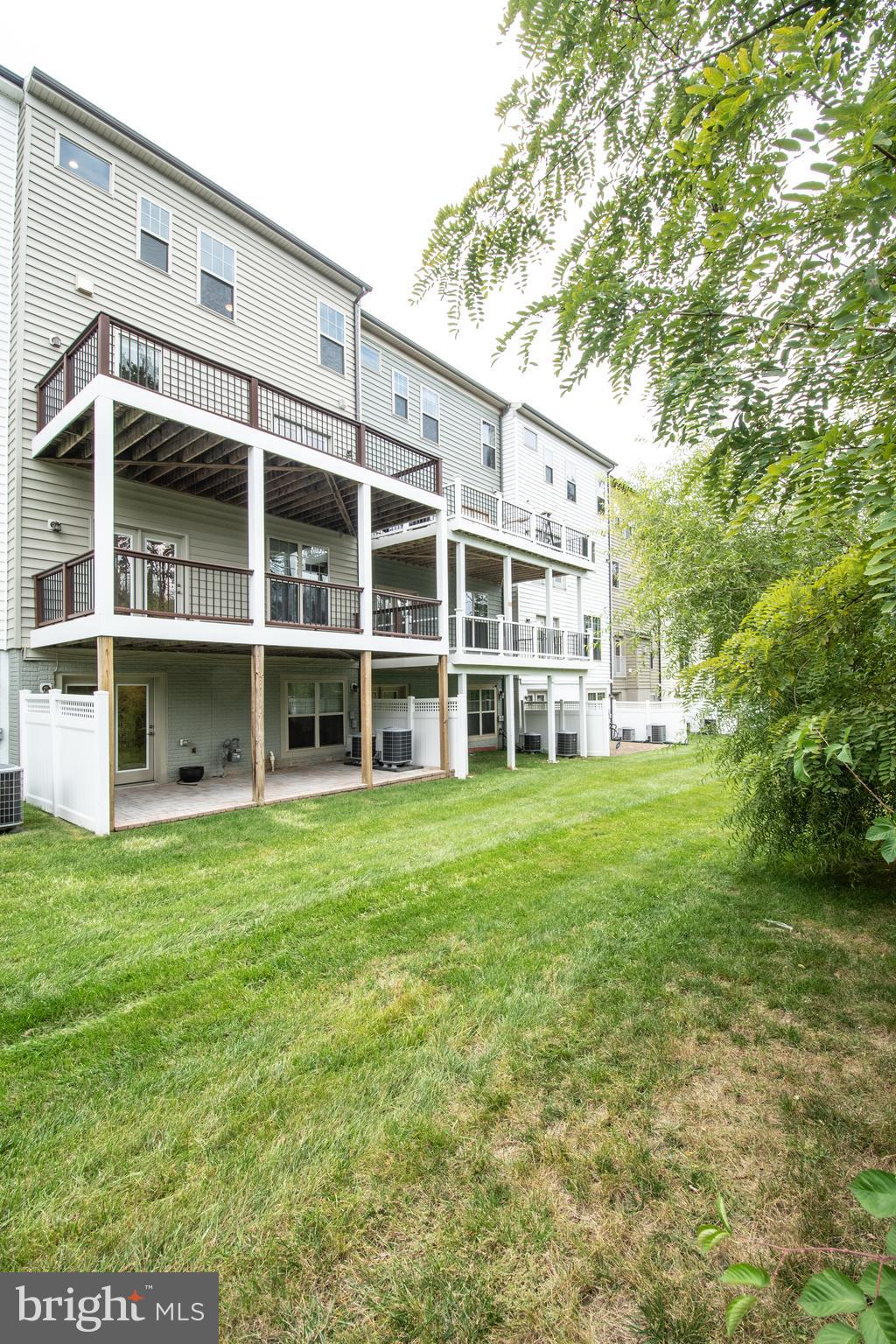 22199 Falling Terrace Ashburn, VA 20148 - Photo 18 of 58 a view of a big yard with large trees