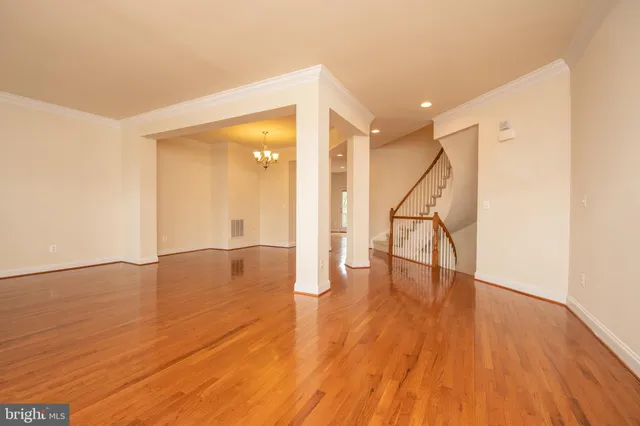 a kitchen with stainless steel appliances granite countertop a refrigerator a sink a stove and oven