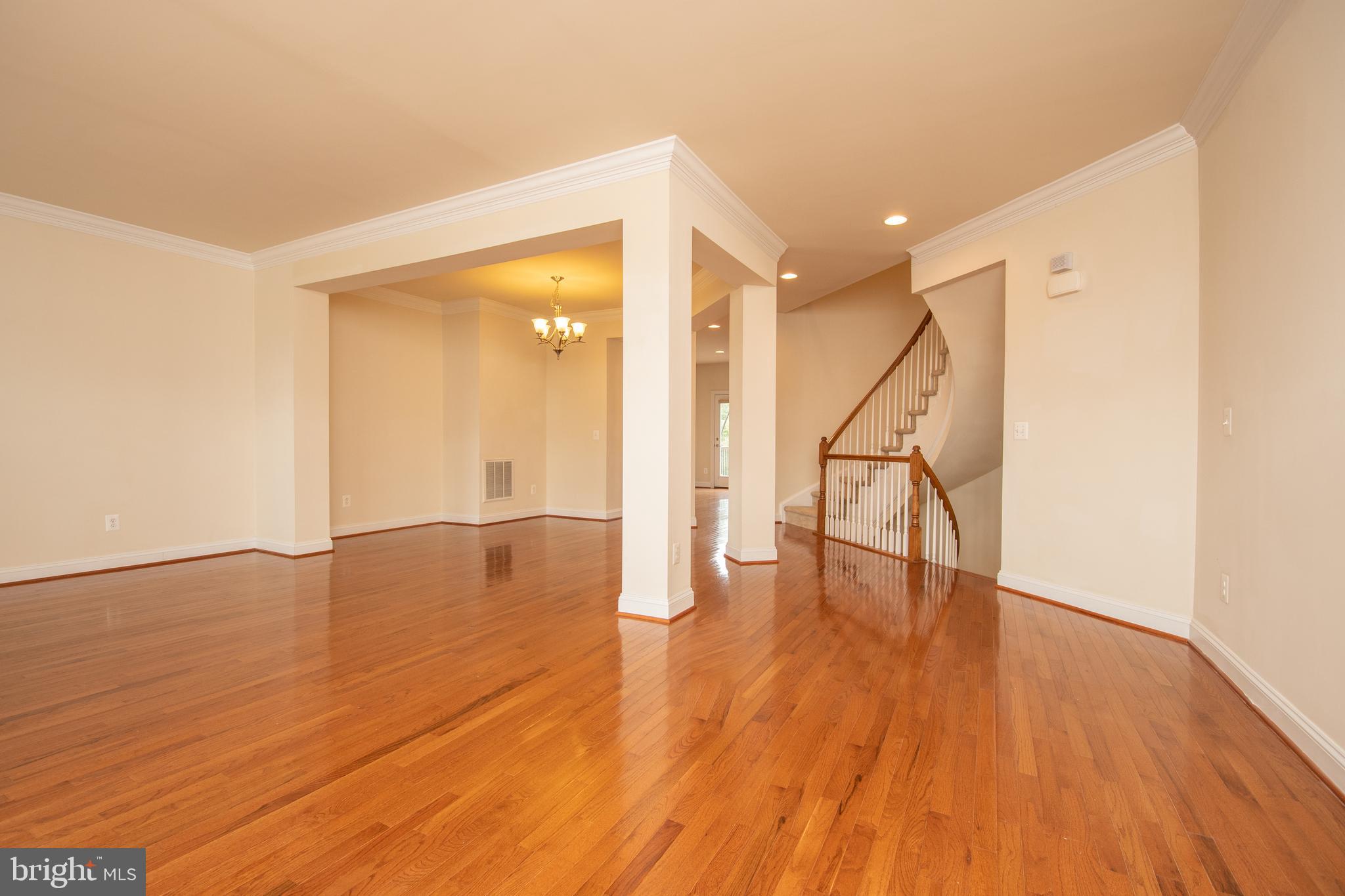 22199 Falling Terrace Ashburn, VA 20148 - Photo 21 of 58 a view of an empty room with wooden floor and a window