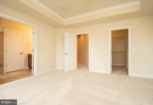 a bathroom with a double vanity sink a mirror and a bathtub