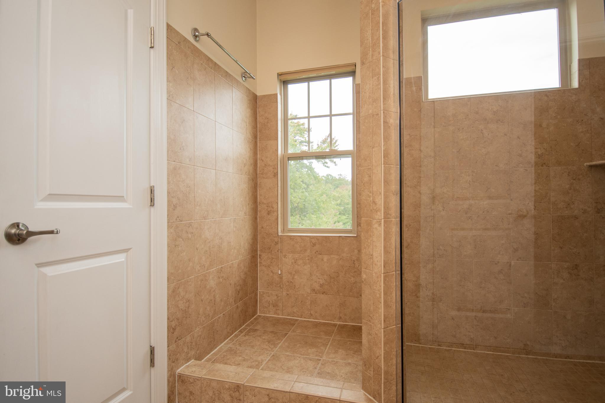 22199 Falling Terrace Ashburn, VA 20148 - Photo 40 of 58 a bathroom with a window