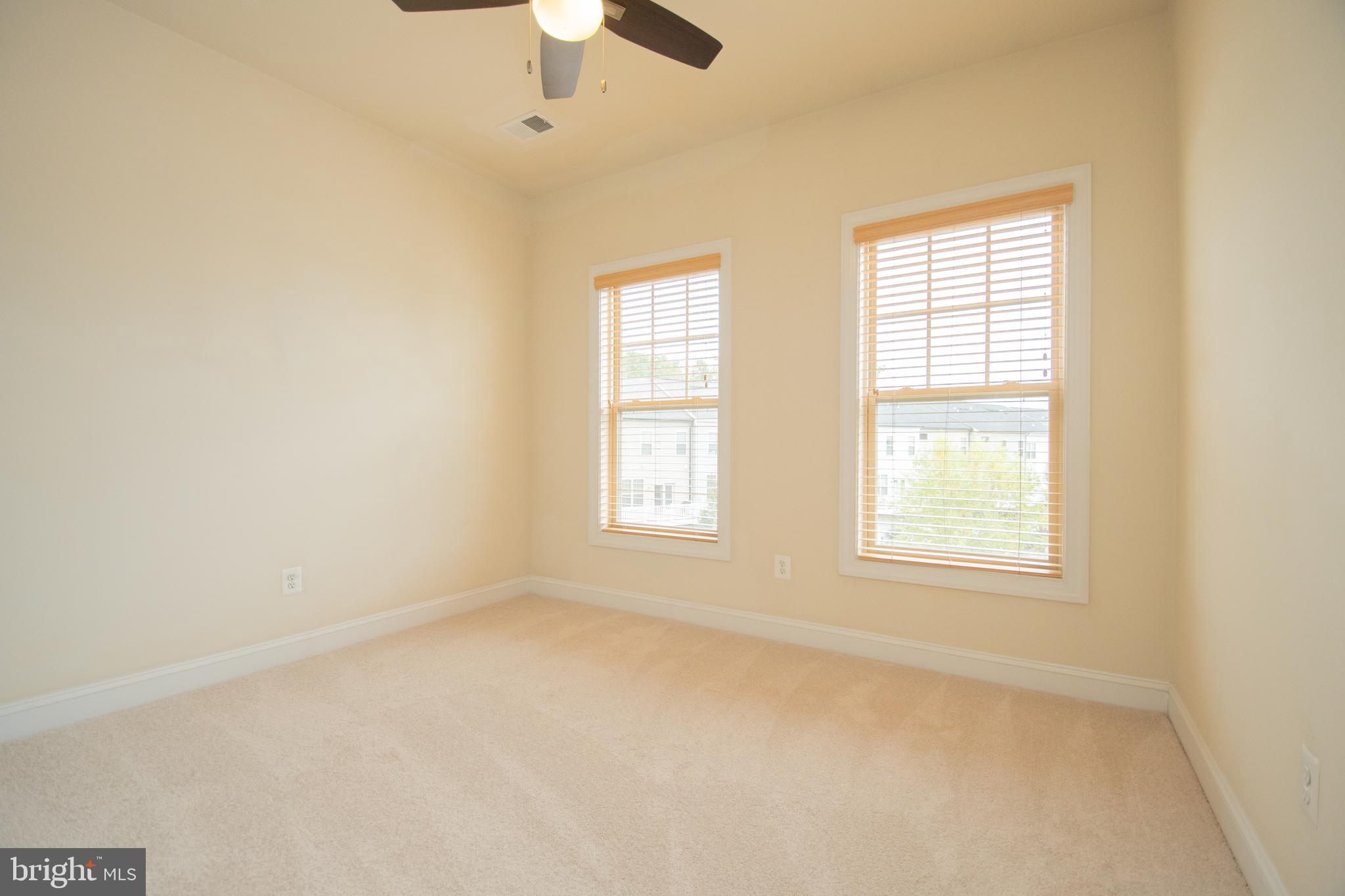 22199 Falling Terrace Ashburn, VA 20148 - Photo 45 of 58 an empty room with a window and a fan