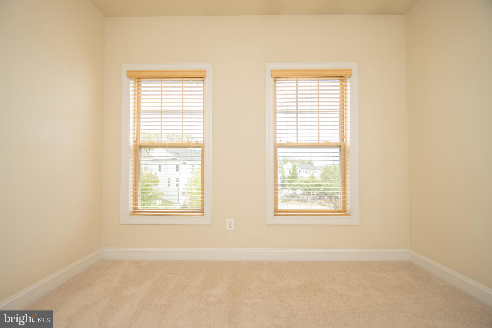 22199 Falling Terrace Ashburn, VA 20148 - Photo 49 of 58 an empty room with windows