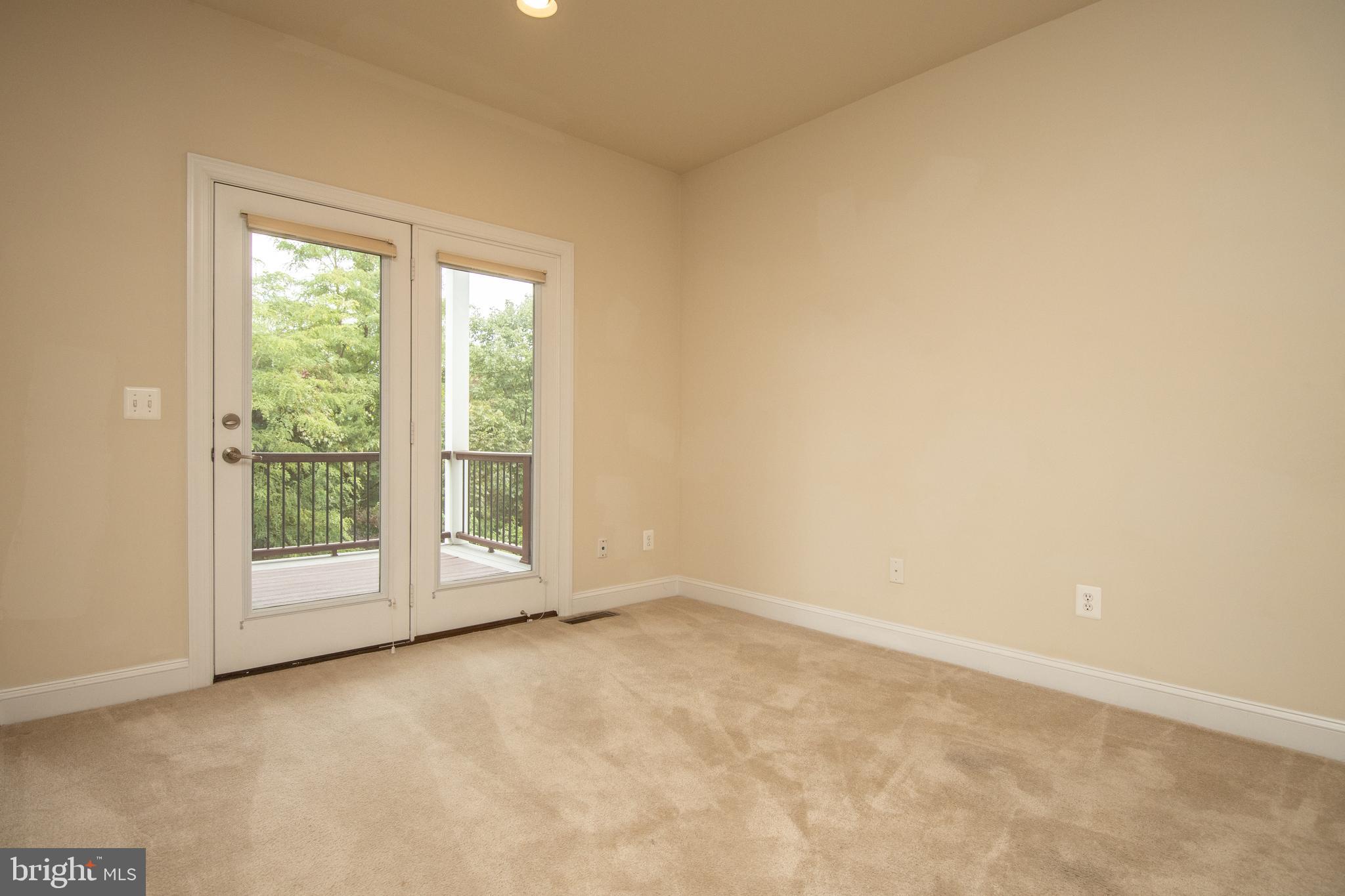22199 Falling Terrace Ashburn, VA 20148 - Photo 5 of 58 an empty room with windows