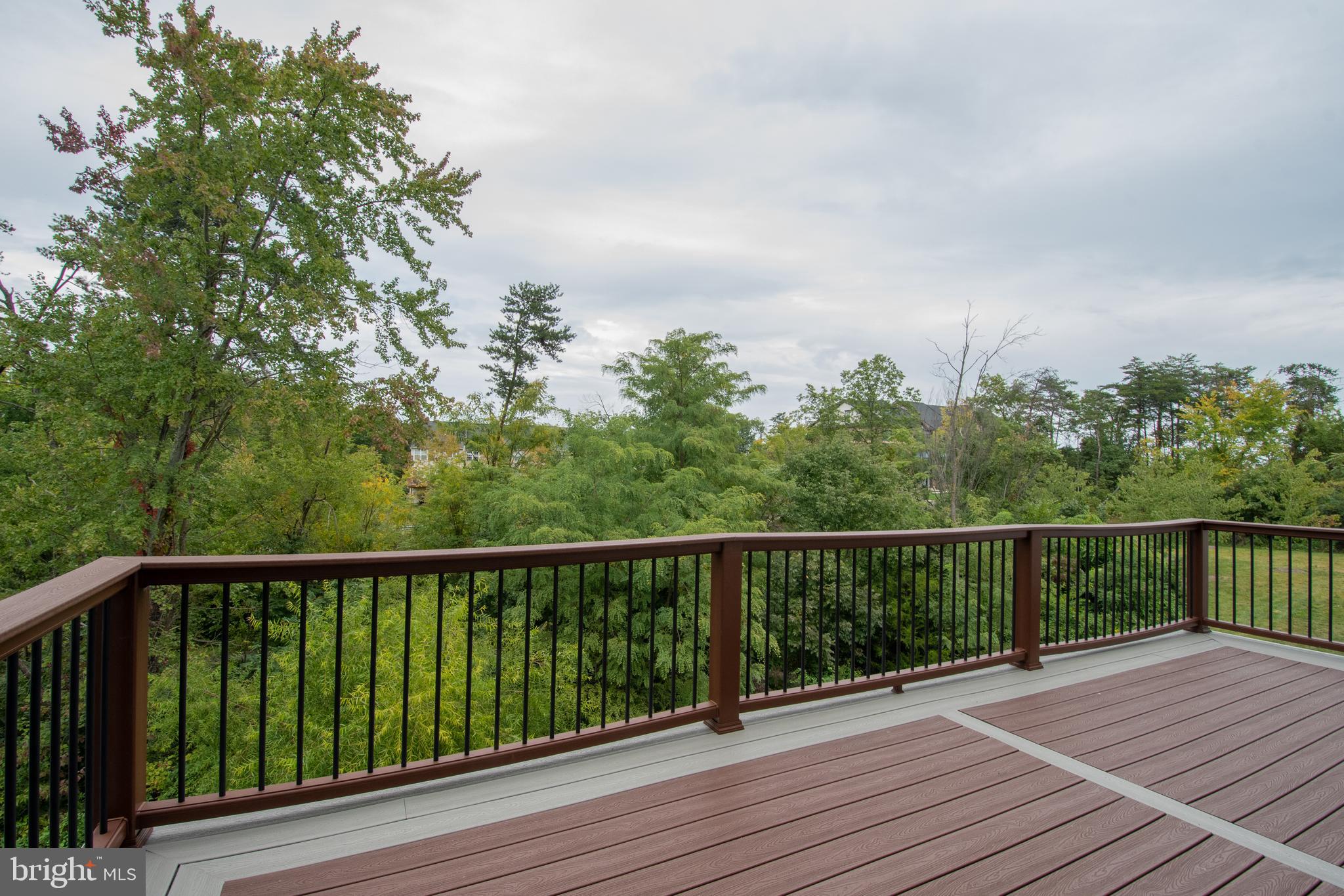 22199 Falling Terrace Ashburn, VA 20148 - Photo 51 of 58 a view of balcony with wooden floor and fence