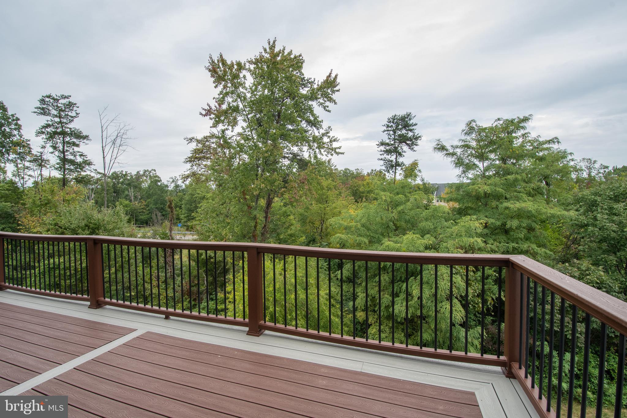 22199 Falling Terrace Ashburn, VA 20148 - Photo 52 of 58 a view of balcony with wooden floor and fence