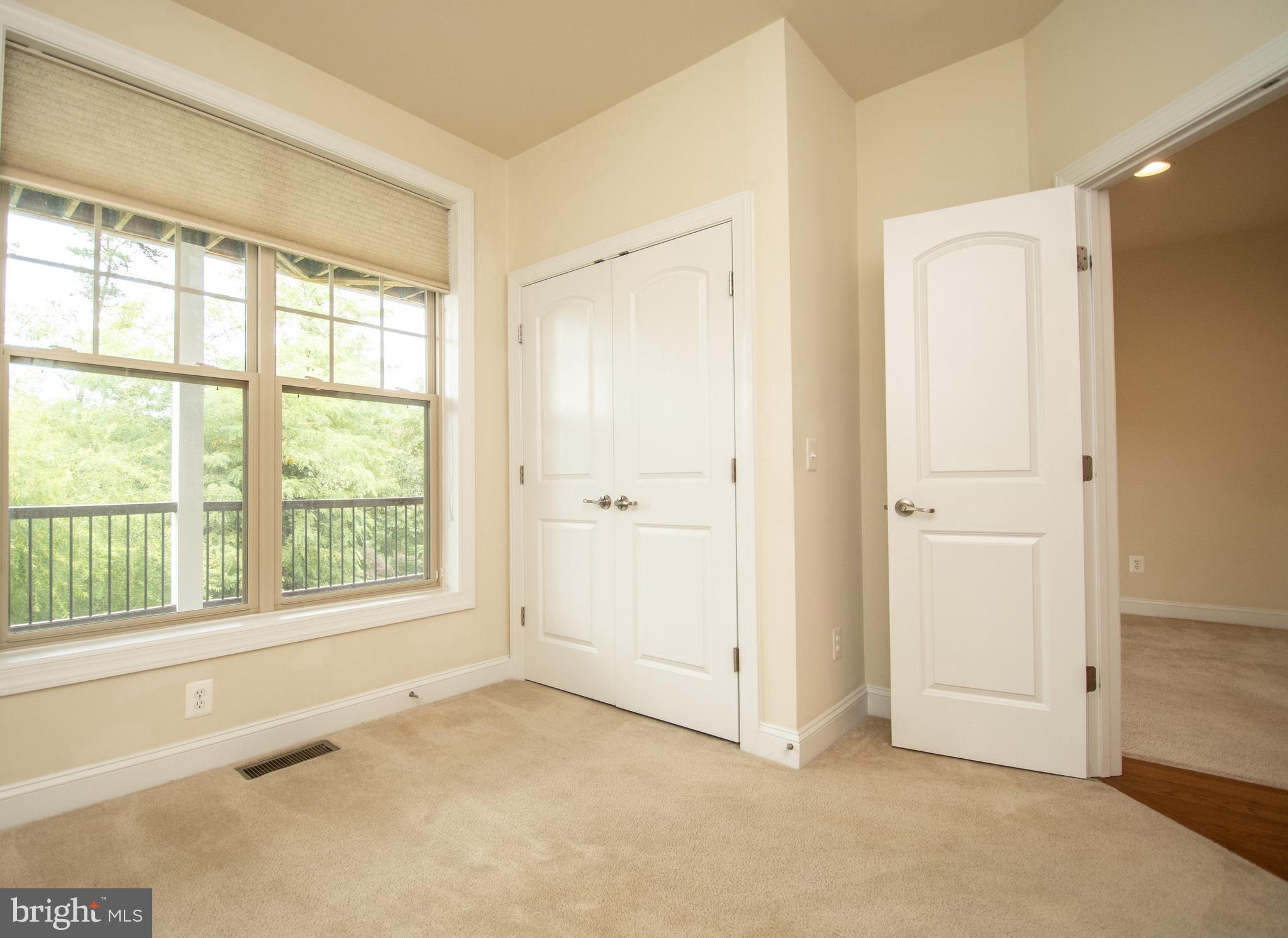 22199 Falling Terrace Ashburn, VA 20148 - Photo 9 of 58 a view of an empty room with a window
