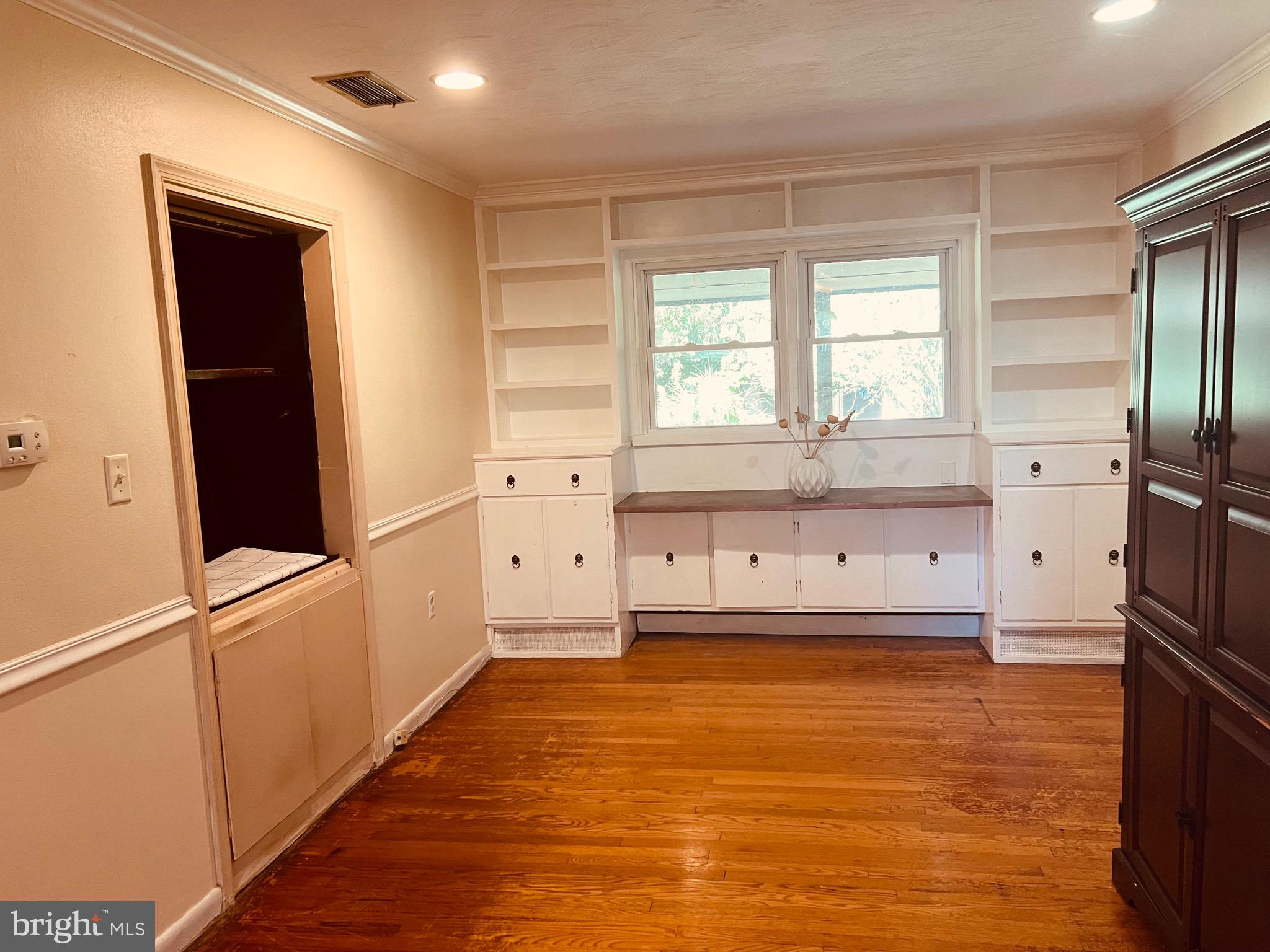 425 Beechcroft Road Winchester, VA 22601 - Photo 14 of 21 a view of an empty room with wooden floor and a window
