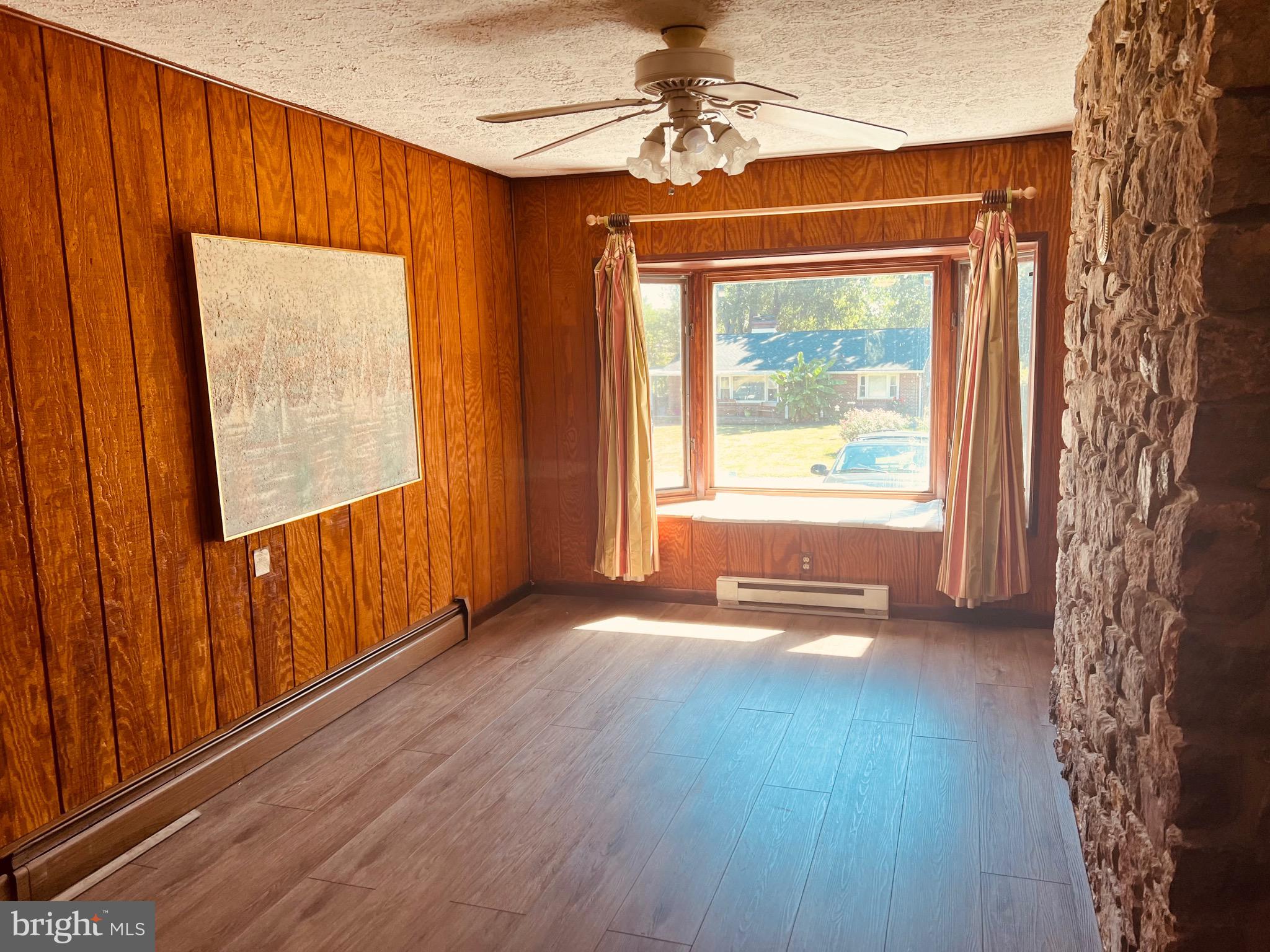 425 Beechcroft Road Winchester, VA 22601 - Photo 18 of 21 wooden floor in an empty room with a window