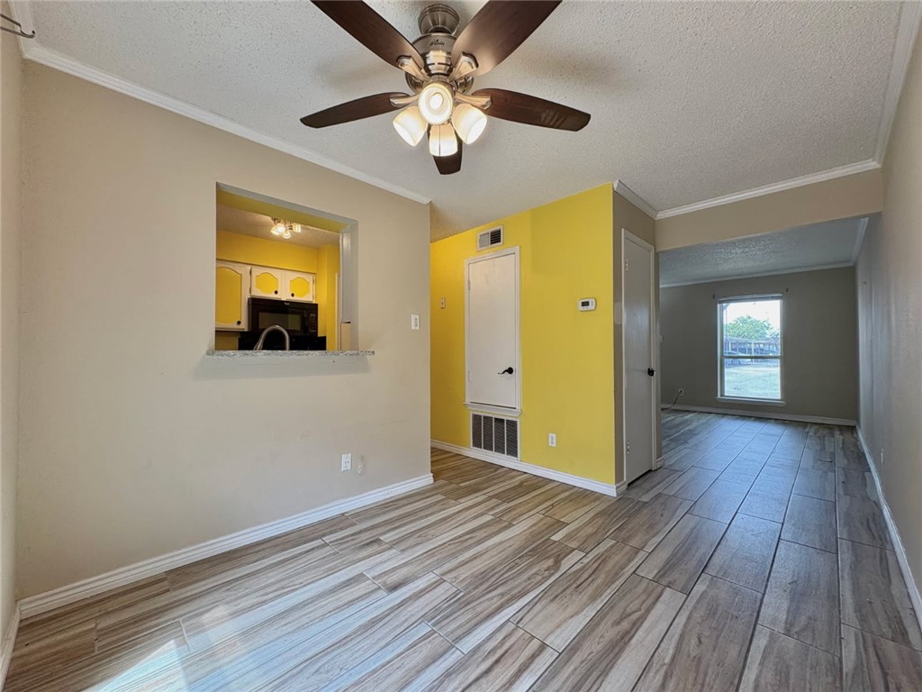 6702 Everhart Road, Unit H105 Corpus Christi, TX 78413 - Photo 4 of 18 a view of a livingroom with wooden floor